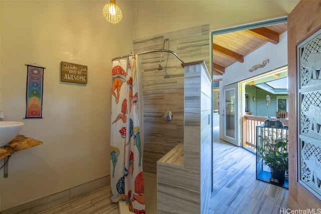 bathroom with wood ceiling, wood-type flooring, vaulted ceiling with beams, sink, and a shower with shower curtain