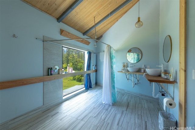 interior space with wood ceiling, high vaulted ceiling, curtained shower, and hardwood / wood-style floors