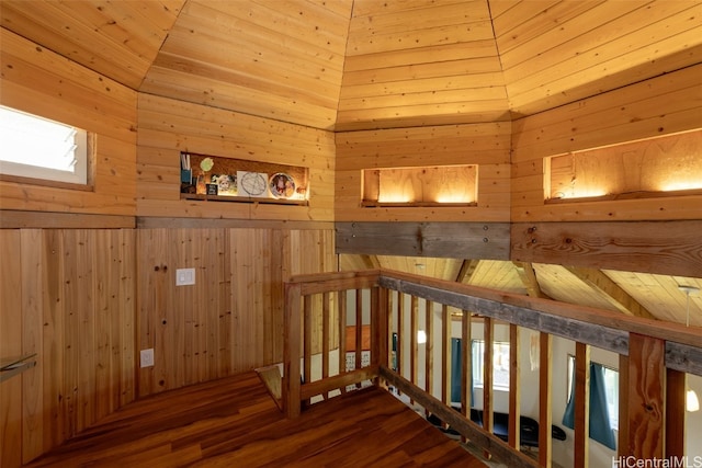 staircase featuring hardwood / wood-style flooring, wooden ceiling, and wood walls