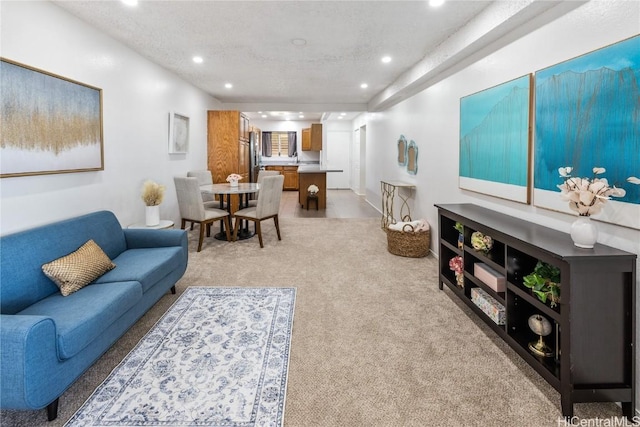 living room featuring light carpet and recessed lighting