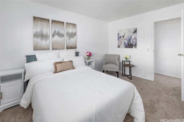 bedroom featuring light colored carpet