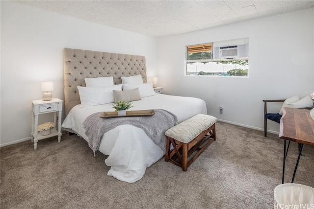 carpeted bedroom with a textured ceiling and an AC wall unit