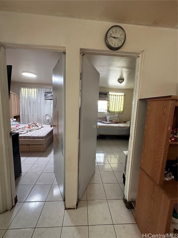 hallway featuring light tile patterned floors