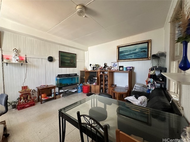 living room with wood walls