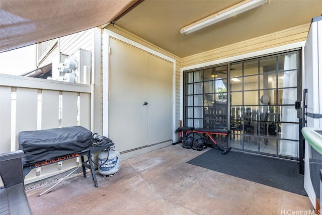 entrance to property featuring a patio area