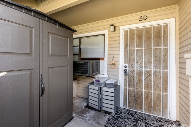 doorway to property with cooling unit