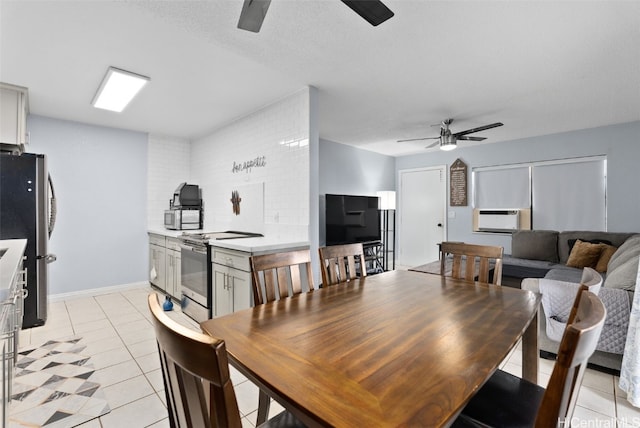 dining area with ceiling fan, a textured ceiling, light tile patterned floors, and cooling unit