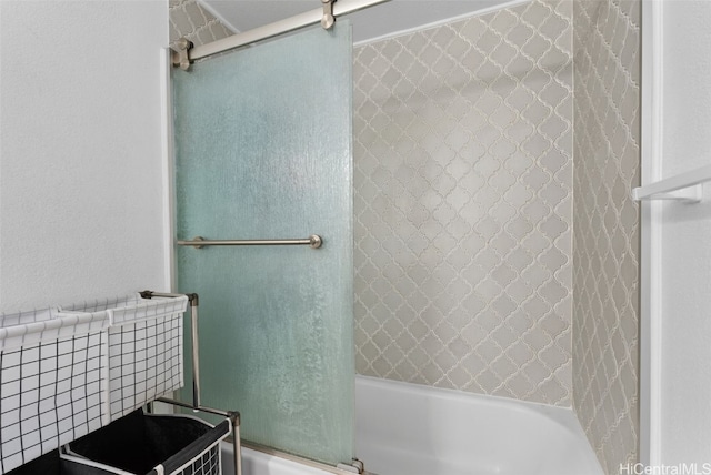 bathroom featuring shower / bath combination with glass door