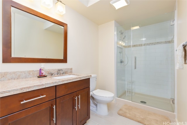 bathroom featuring vanity, a shower with shower door, toilet, and tile patterned floors