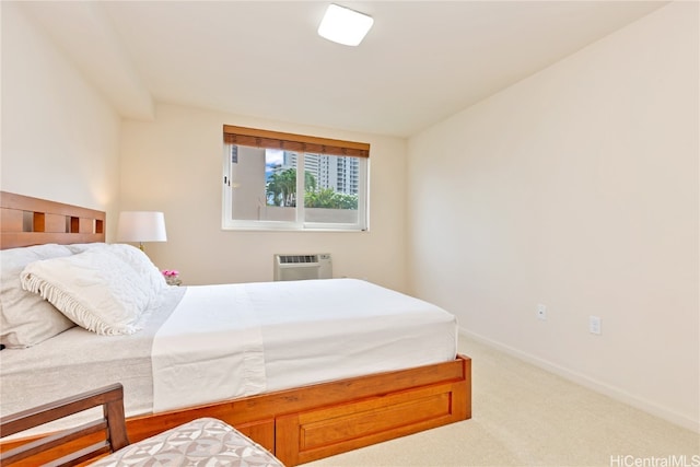 carpeted bedroom featuring a wall mounted AC