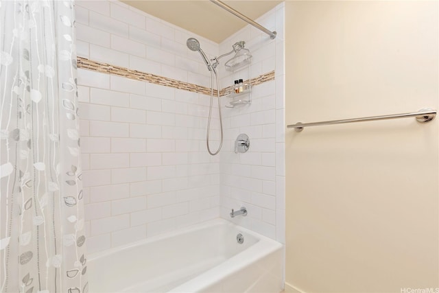 full bath featuring shower / bath combination with curtain and baseboards