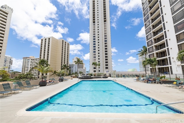 view of swimming pool with a patio area