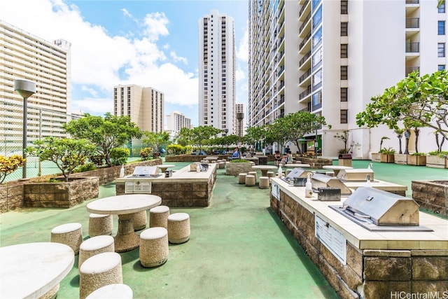 surrounding community featuring an outdoor kitchen