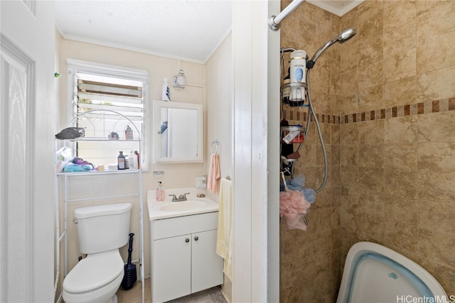 bathroom featuring vanity, toilet, and ornamental molding