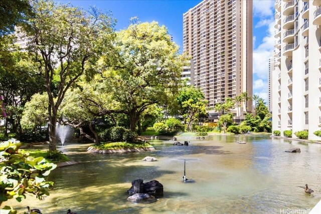 view of community with a water view