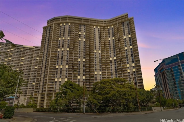 view of outdoor building at dusk