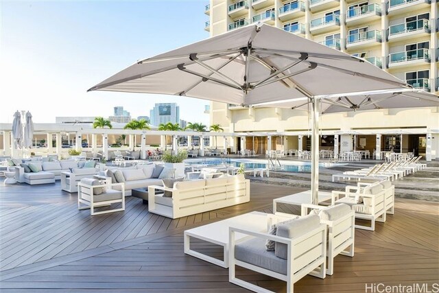 410 Atkinson Dr Unit 932, Honolulu, HI 96814 - wooden terrace featuring an outdoor hangout area and a community pool