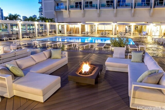410 Atkinson Dr Unit 932, Honolulu, HI 96814 - community pool featuring an outdoor living space with a fire pit and a deck