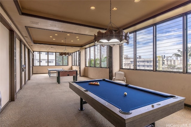 rec room with pool table, light carpet, and a tray ceiling