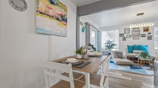 dining area with hardwood / wood-style flooring