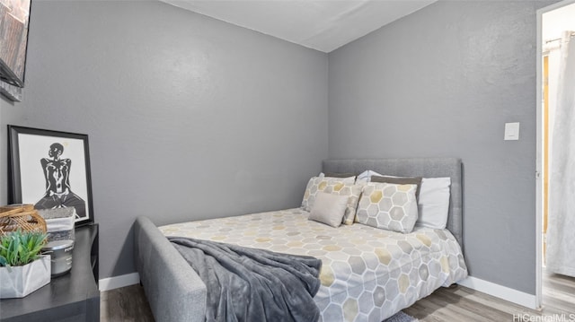 bedroom featuring wood-type flooring