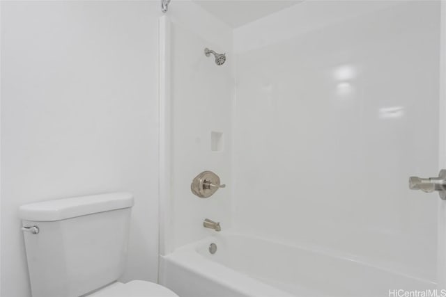 bathroom with toilet and bathtub / shower combination