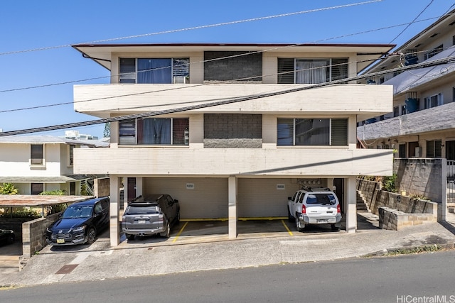 view of front facade with a carport