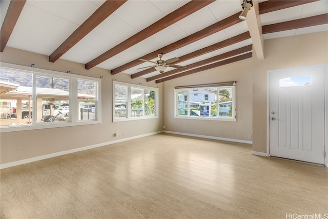 interior space with lofted ceiling with beams, ceiling fan, and light wood-type flooring