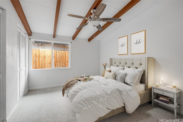 carpeted bedroom featuring ceiling fan and lofted ceiling with beams