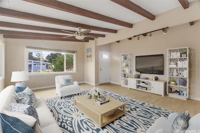 living room with lofted ceiling with beams, ceiling fan, and light hardwood / wood-style floors