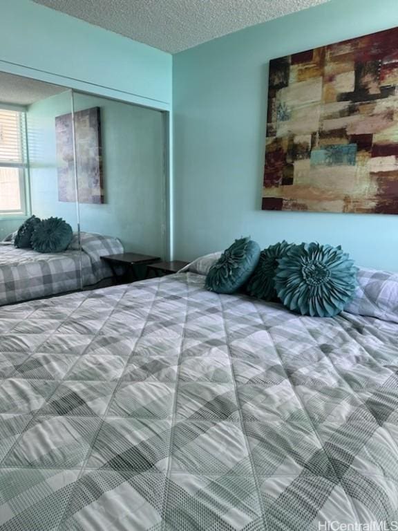 bedroom featuring a closet and a textured ceiling