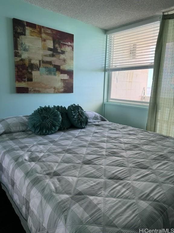 bedroom featuring a textured ceiling