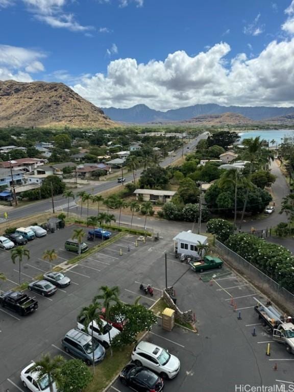 drone / aerial view featuring a water and mountain view