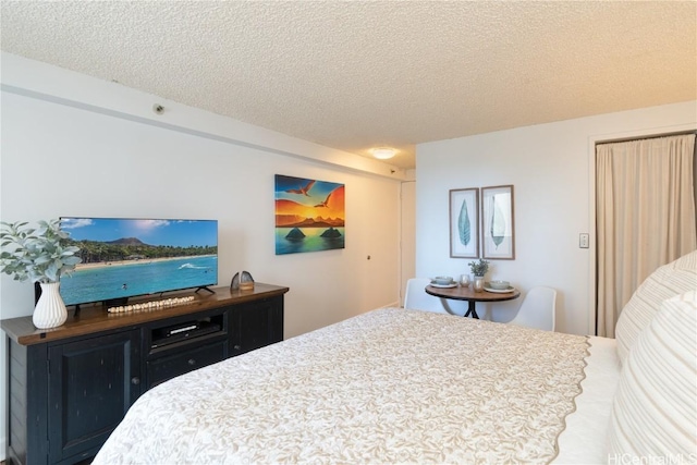 bedroom featuring a textured ceiling