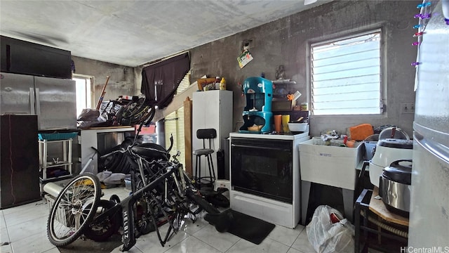 misc room with light tile patterned floors