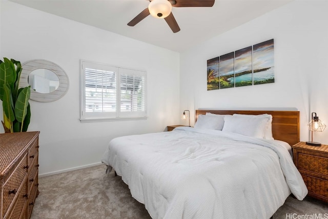 bedroom featuring ceiling fan and light carpet