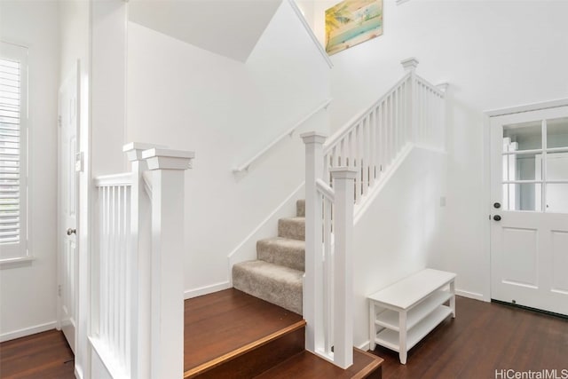 stairs featuring wood-type flooring