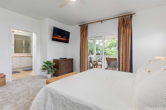 bedroom featuring ensuite bathroom, sink, access to exterior, ceiling fan, and light colored carpet