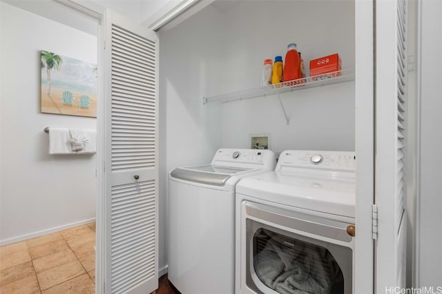 clothes washing area with independent washer and dryer