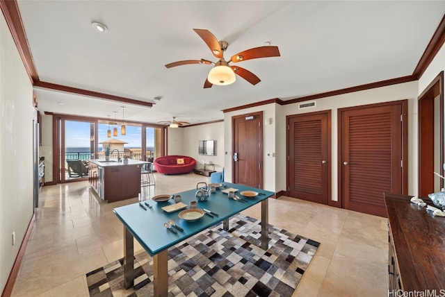 rec room featuring ornamental molding, sink, and light tile patterned floors