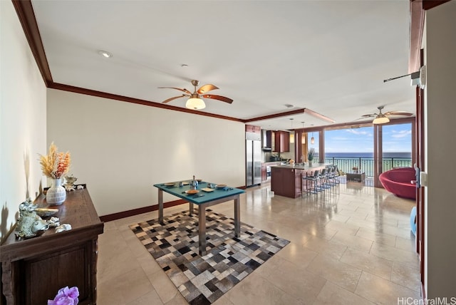 rec room with ceiling fan, light tile patterned flooring, a water view, and crown molding