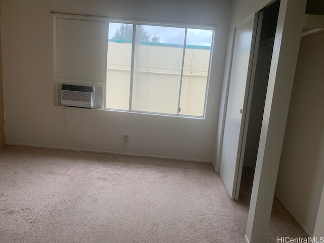 carpeted empty room with cooling unit and a water view