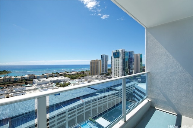 balcony featuring a water view