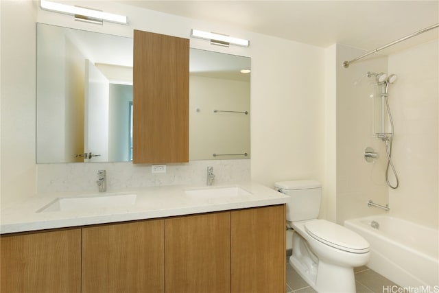 full bathroom featuring toilet, bathtub / shower combination, vanity, and tile patterned flooring