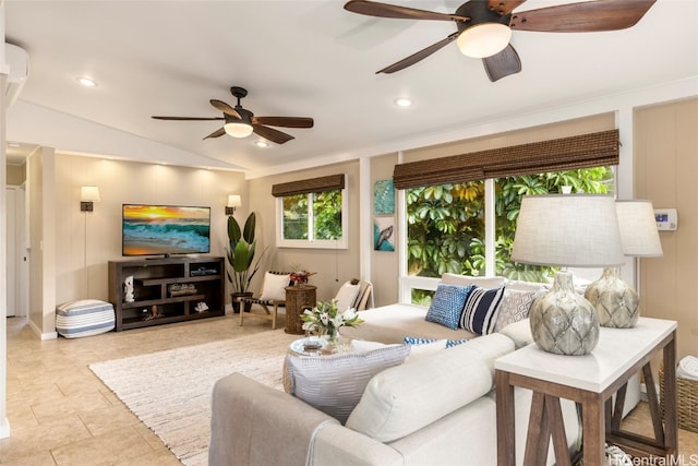 living room featuring ceiling fan and vaulted ceiling