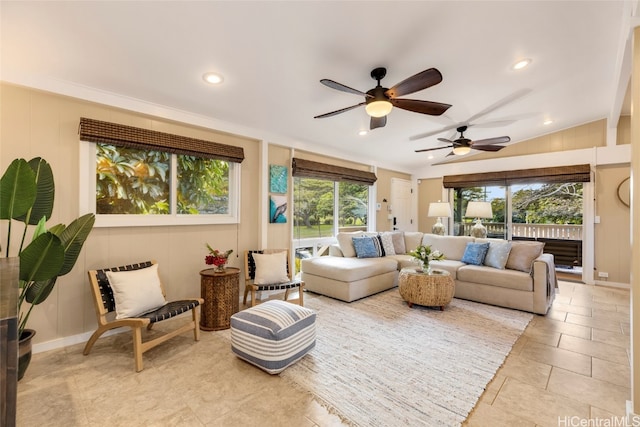 living room featuring lofted ceiling, light tile patterned flooring, ceiling fan, and plenty of natural light