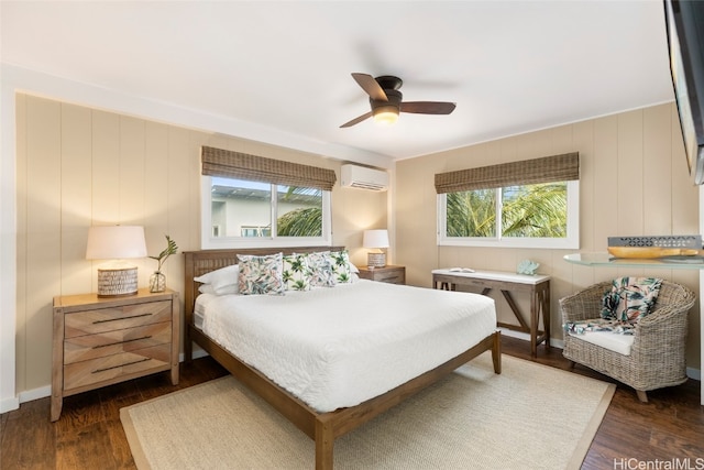 bedroom featuring ceiling fan, a wall mounted AC, dark hardwood / wood-style flooring, and wooden walls