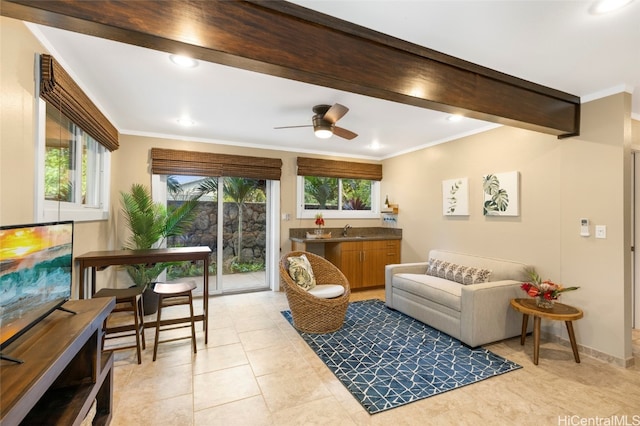 living room with crown molding, sink, and light tile patterned floors