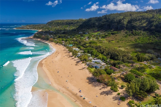 drone / aerial view featuring a water view and a beach view