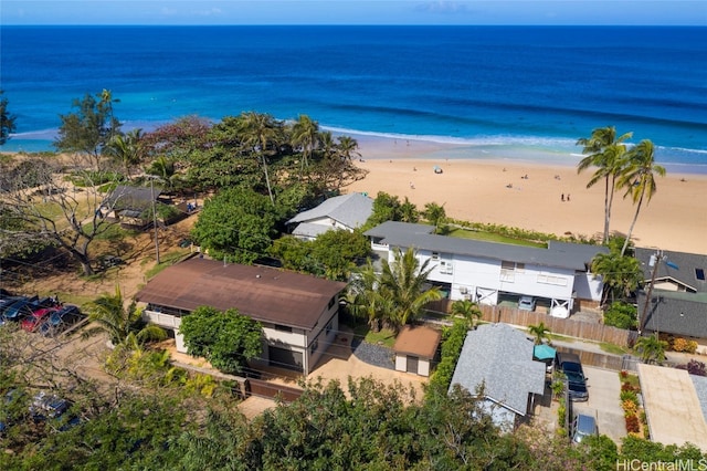 drone / aerial view featuring a water view and a beach view